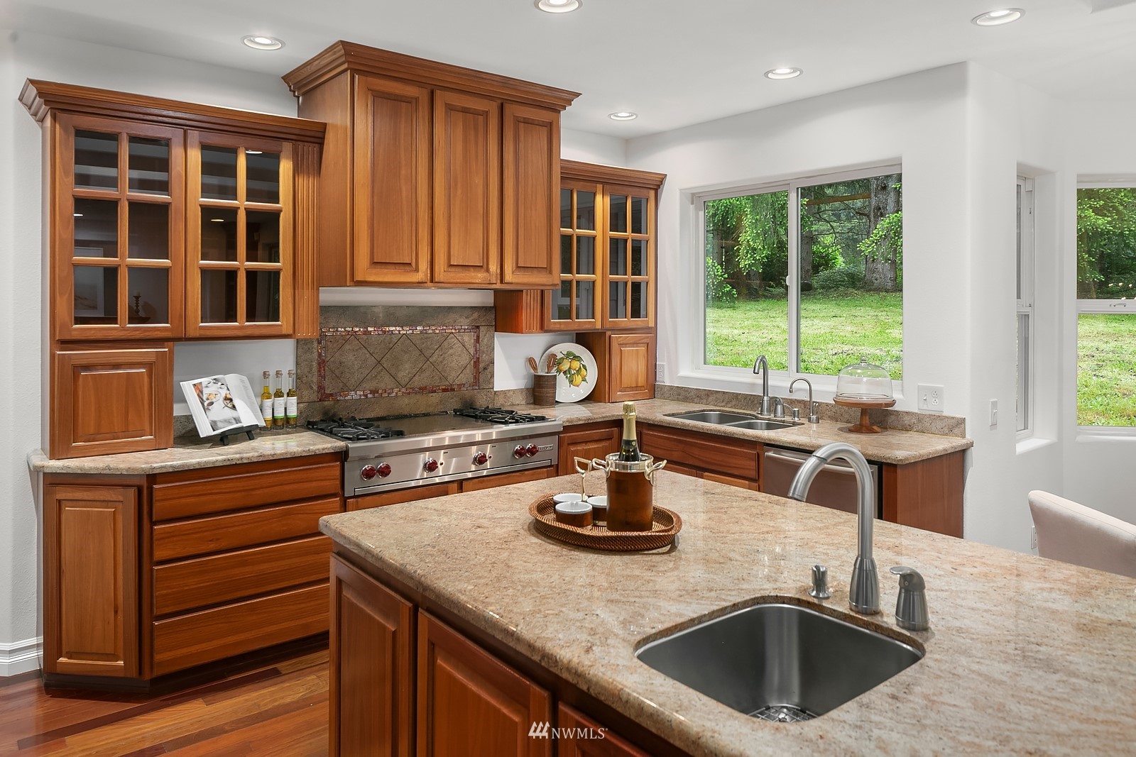 18512 Southeast Petrovitsky Road Renton, WA 98058 - Photo 13 of 40 a kitchen with a stove a sink and a cabinets