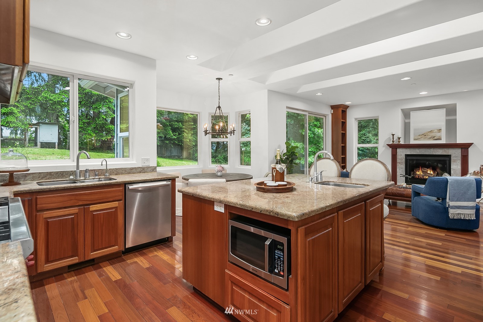 18512 Southeast Petrovitsky Road Renton, WA 98058 - Photo 14 of 40 a kitchen with stainless steel appliances granite countertop a stove and a sink