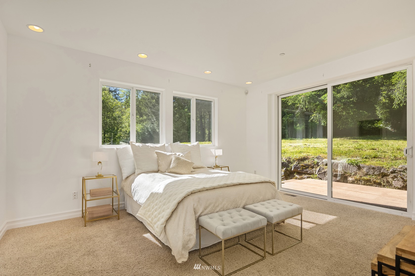 18512 Southeast Petrovitsky Road Renton, WA 98058 - Photo 18 of 40 a bedroom with a bed and large windows