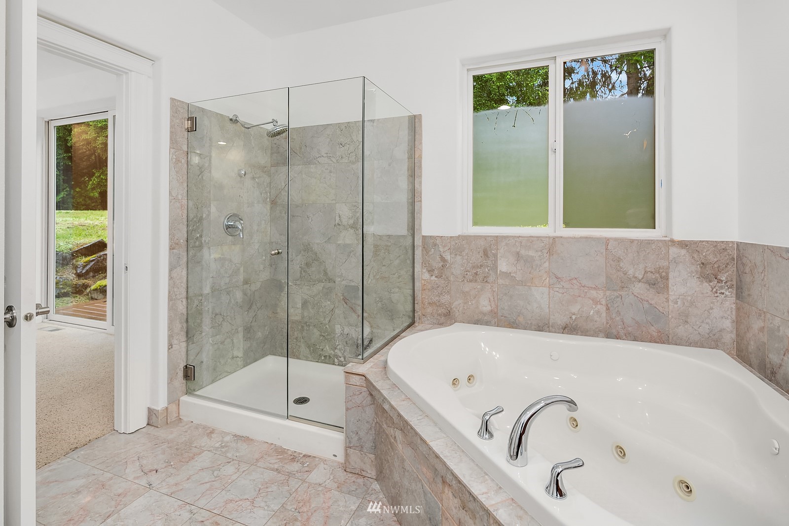18512 Southeast Petrovitsky Road Renton, WA 98058 - Photo 20 of 40 a bathroom with a tub and shower