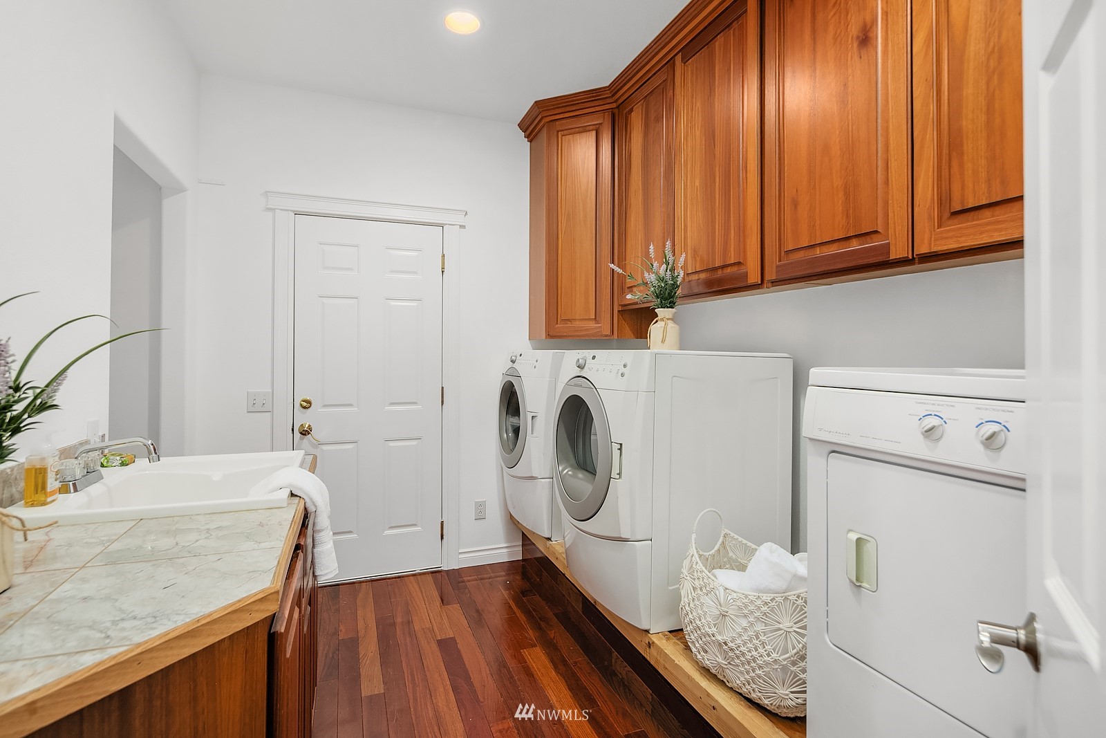 18512 Southeast Petrovitsky Road Renton, WA 98058 - Photo 21 of 40 a utility room with cabinets washer and dryer