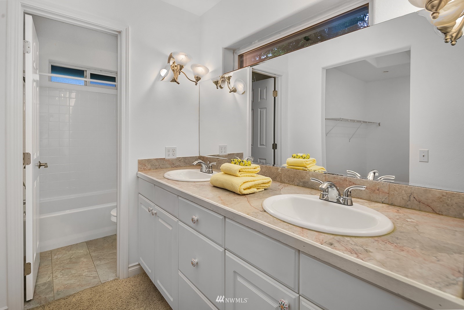 18512 Southeast Petrovitsky Road Renton, WA 98058 - Photo 26 of 40 a bathroom with a granite countertop sink a mirror and a bathtub