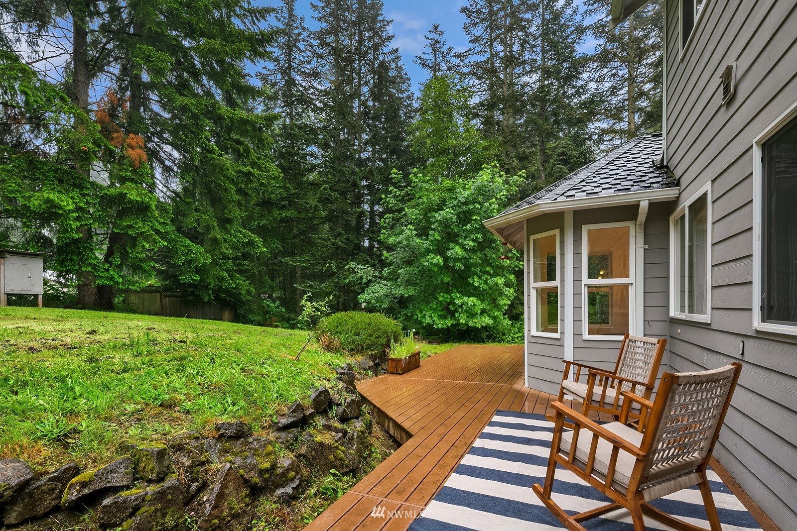 18512 Southeast Petrovitsky Road Renton, WA 98058 - Photo 32 of 40 a view of a backyard with sitting area