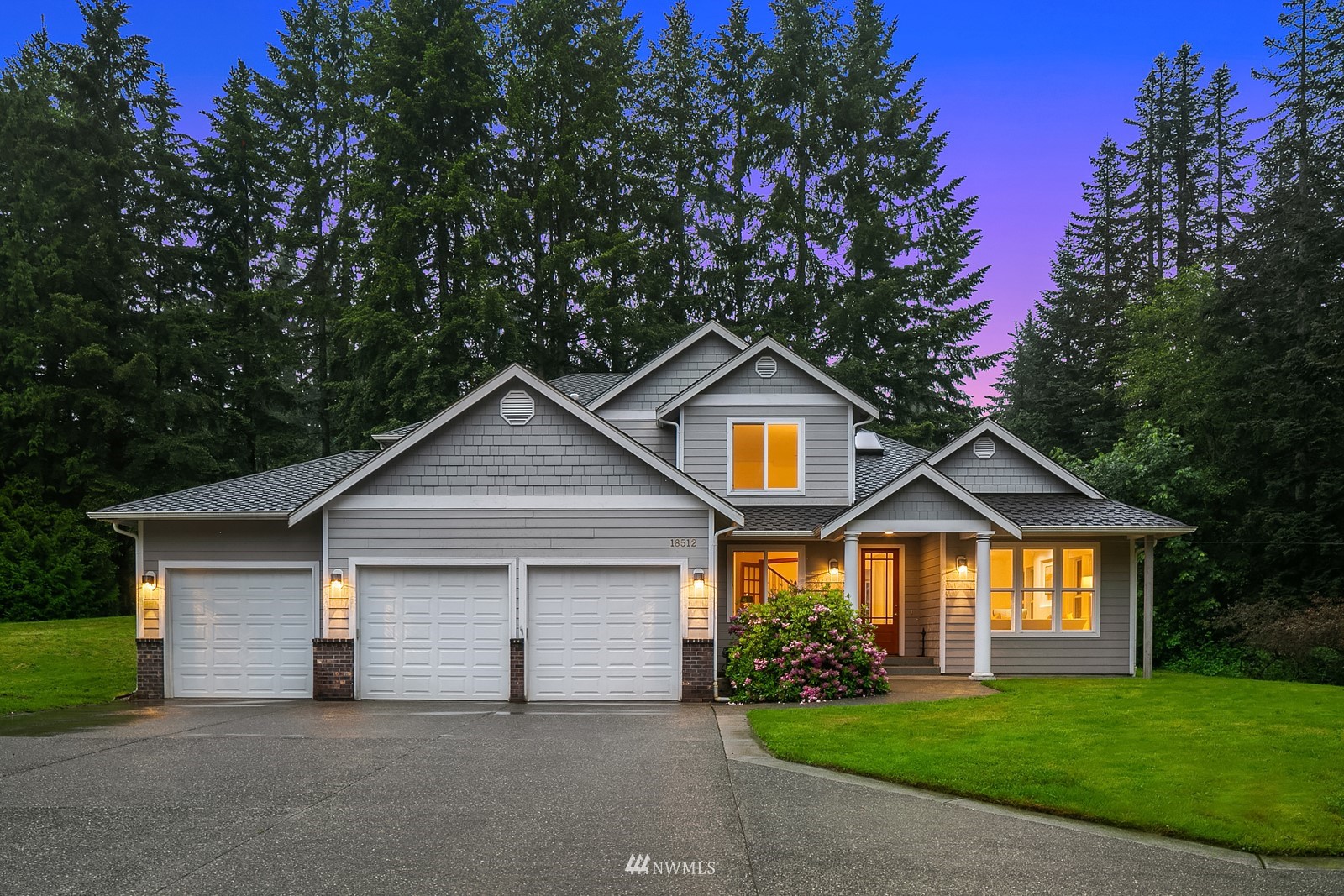 18512 Southeast Petrovitsky Road Renton, WA 98058 - Photo 33 of 40 a front view of a house with a yard and garage