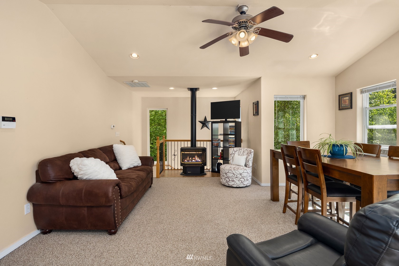 18512 Southeast Petrovitsky Road Renton, WA 98058 - Photo 36 of 40 a living room with furniture and a chandelier