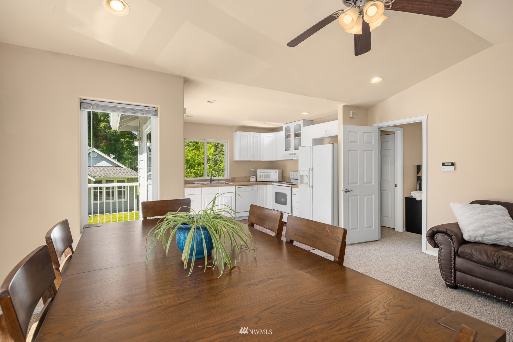 18512 Southeast Petrovitsky Road Renton, WA 98058 - Photo 38 of 40 a view of a dining room with furniture window and wooden floor