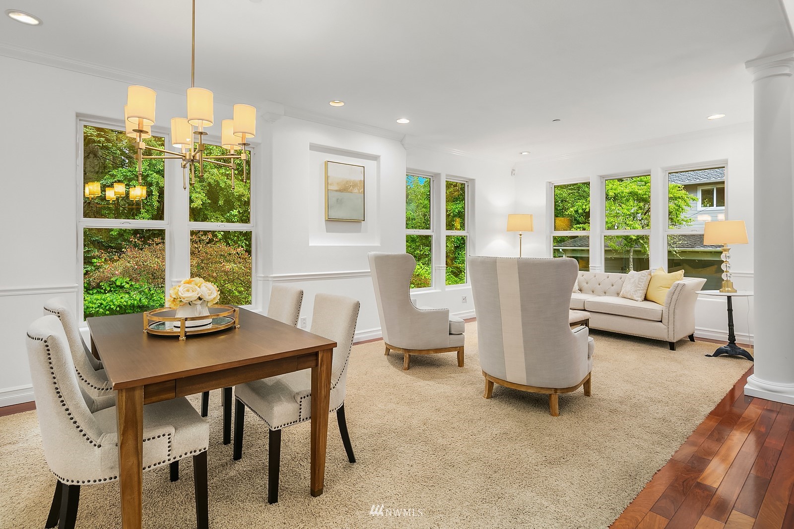 18512 Southeast Petrovitsky Road Renton, WA 98058 - Photo 4 of 40 a dining room with furniture a chandelier and wooden floor