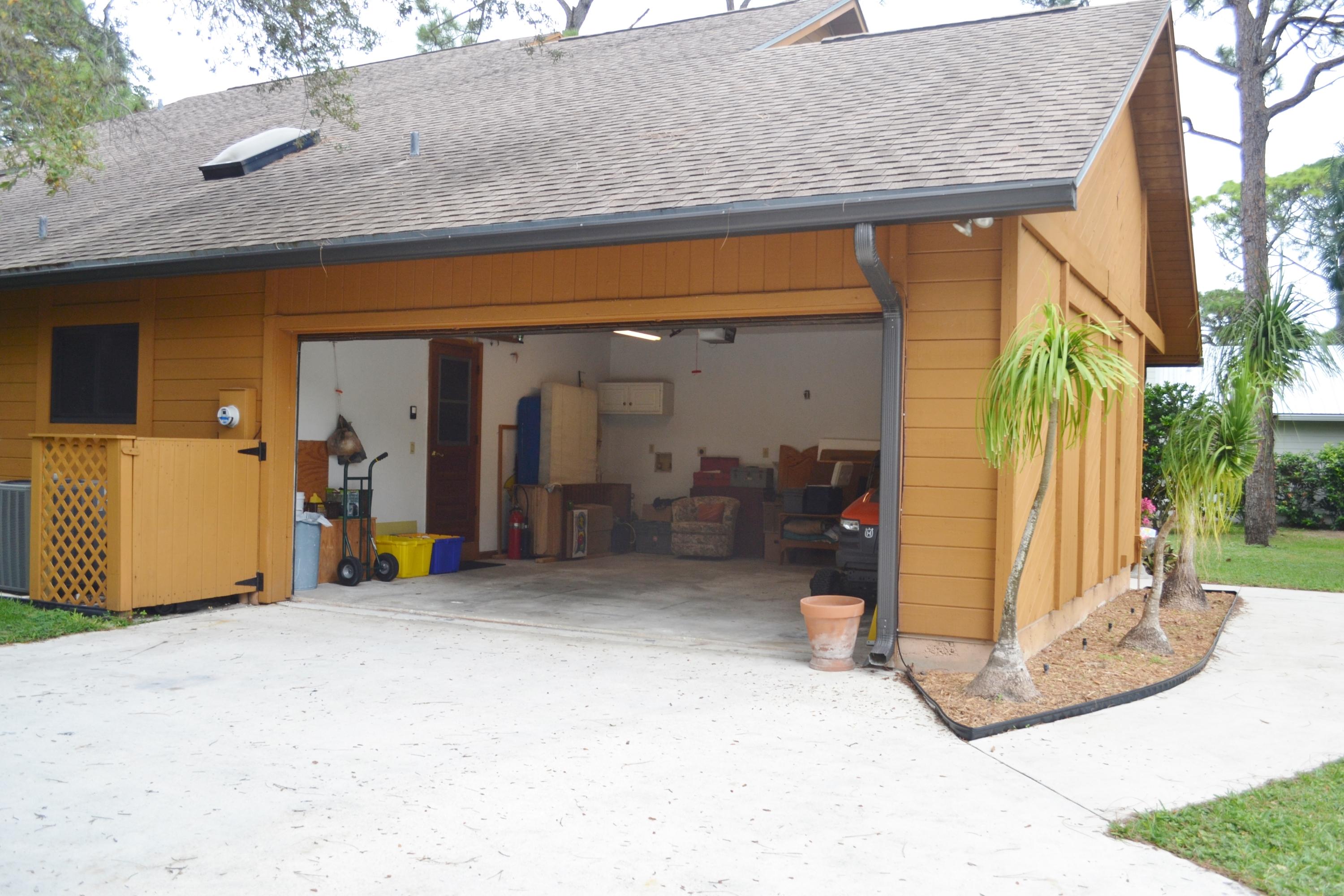 6063 Wood Lake Road Jupiter, FL 33458 - Photo 11 of 60 SIDE LOADED 2 CAR GARAGE