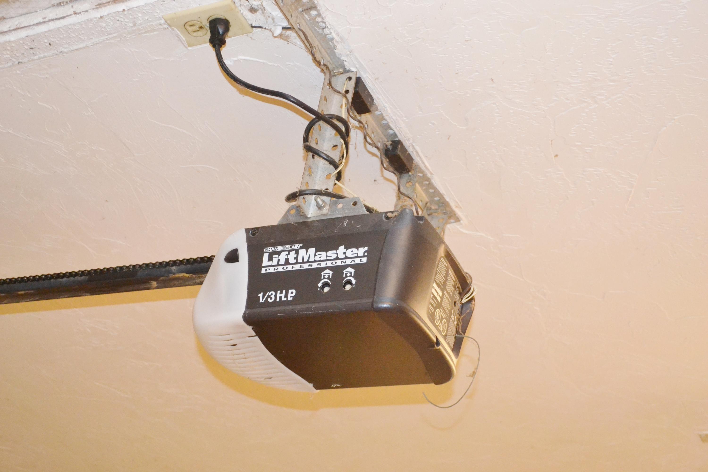 6063 Wood Lake Road Jupiter, FL 33458 - Photo 15 of 60 GARAGE DOOR OPENER