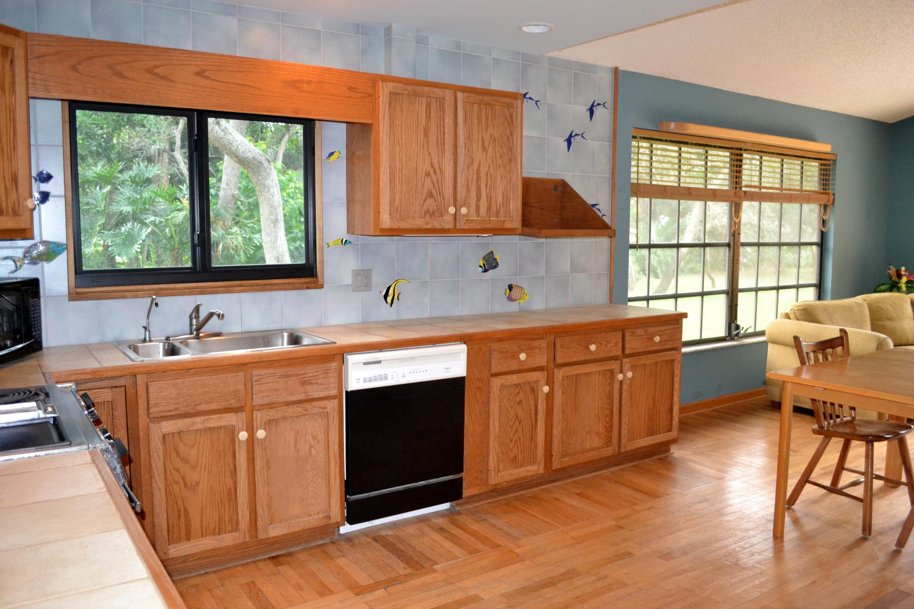 6063 Wood Lake Road Jupiter, FL 33458 - Photo 16 of 60 KITCHEN VIEWS GREEN TREES AND YARD