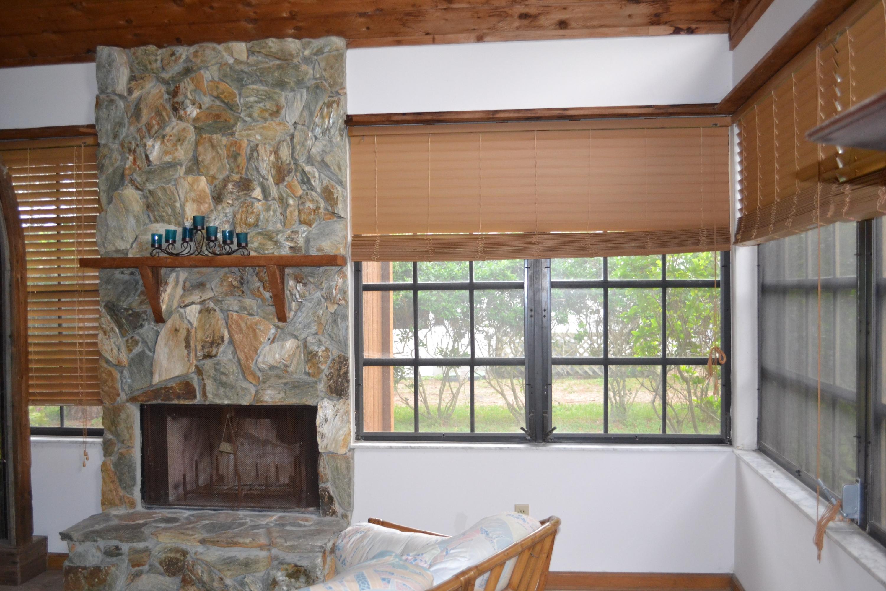 6063 Wood Lake Road Jupiter, FL 33458 - Photo 32 of 60 PICTURE WINDOWS IN LIVING / DINING RM