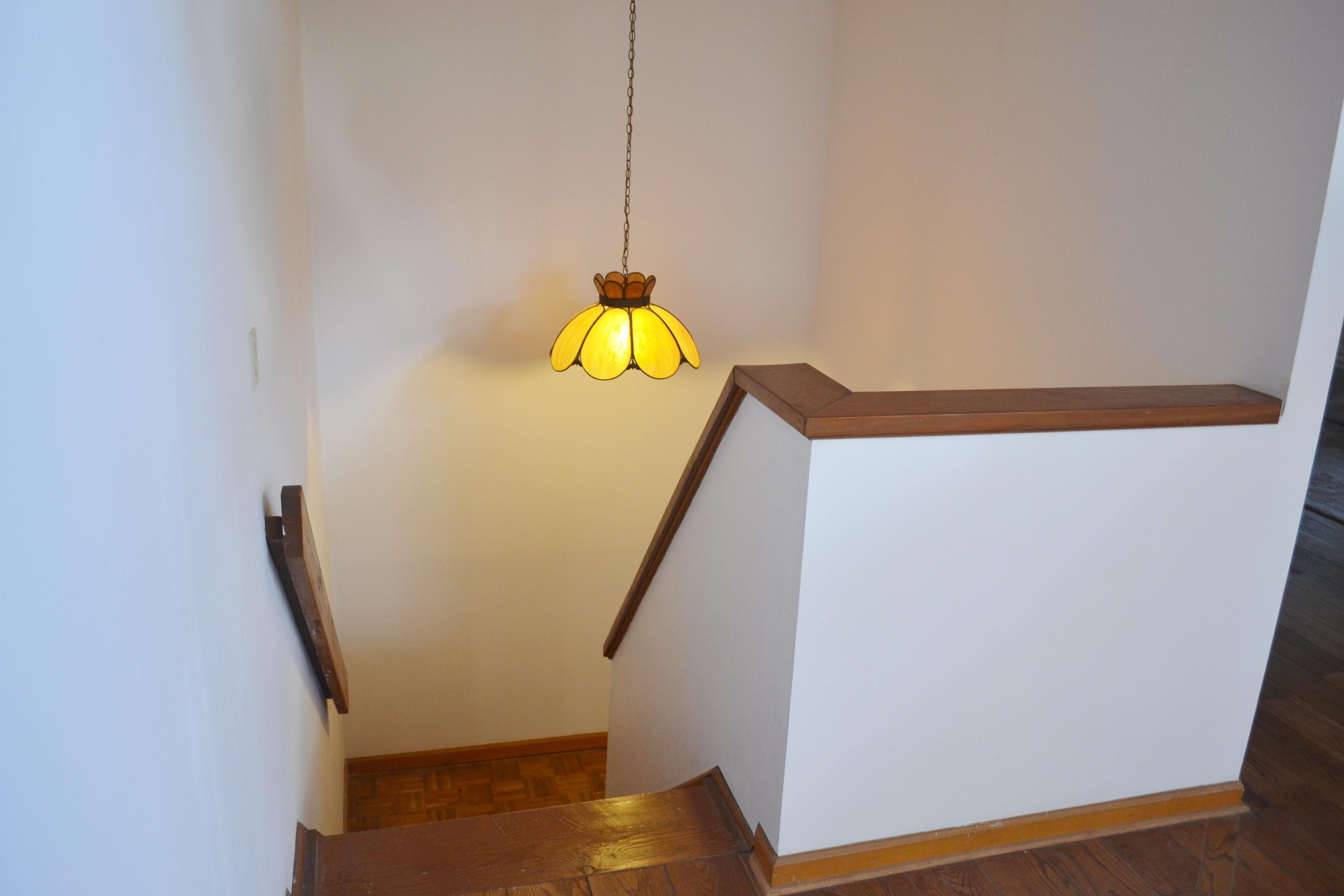 6063 Wood Lake Road Jupiter, FL 33458 - Photo 37 of 60 WOOD COVERED STAIRS FROM 1ST FLOOR