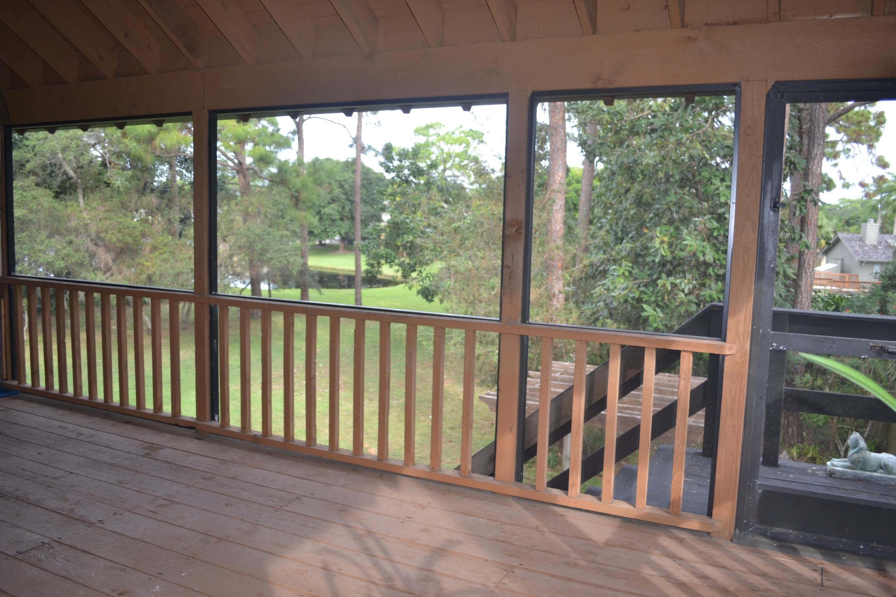 6063 Wood Lake Road Jupiter, FL 33458 - Photo 46 of 60 VIEW OF LAKE AND YARD FROM PORCH