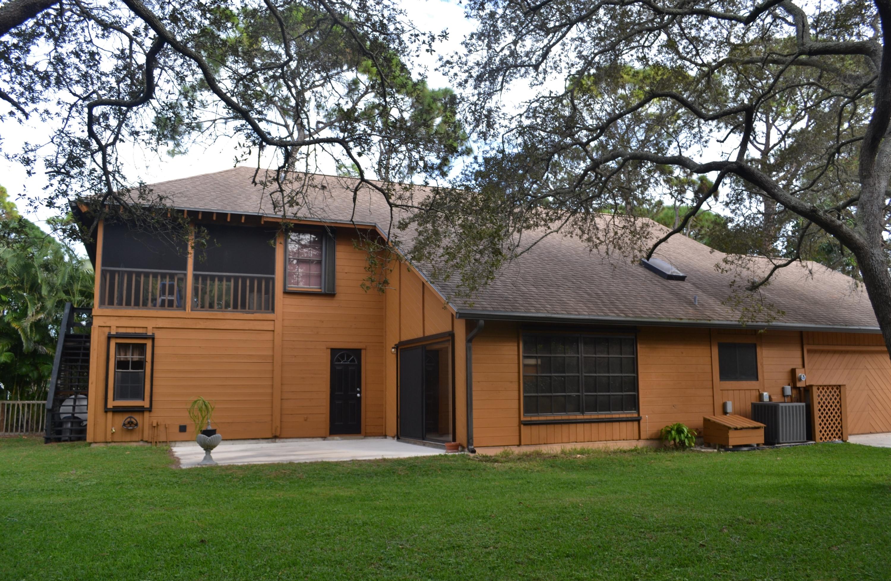 6063 Wood Lake Road Jupiter, FL 33458 - Photo 50 of 60 EXTERIOR SIDE VIEW OF FAMILY ROOM
