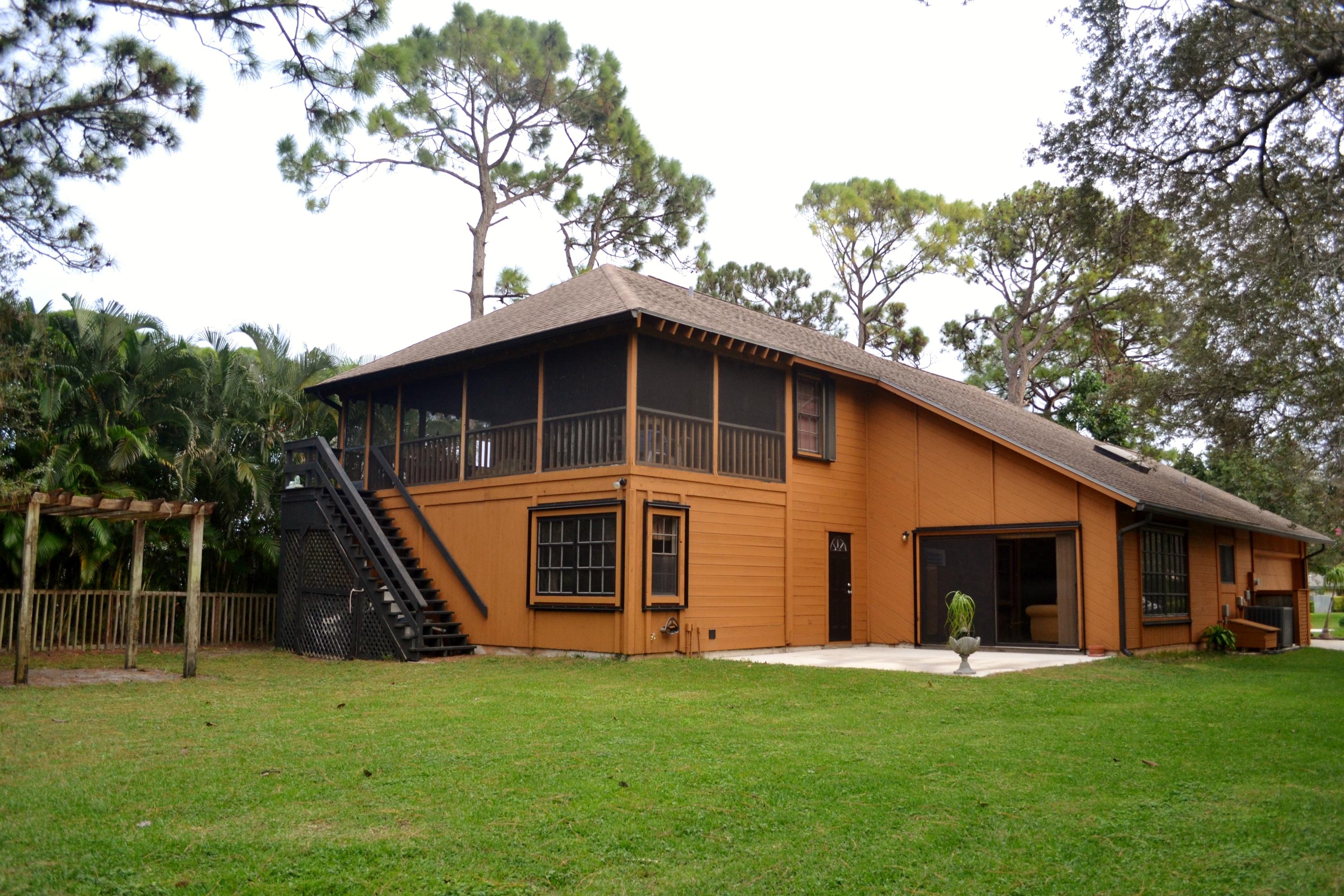 6063 Wood Lake Road Jupiter, FL 33458 - Photo 5 of 60 BACK YARD VIEW OF THE HOUSE