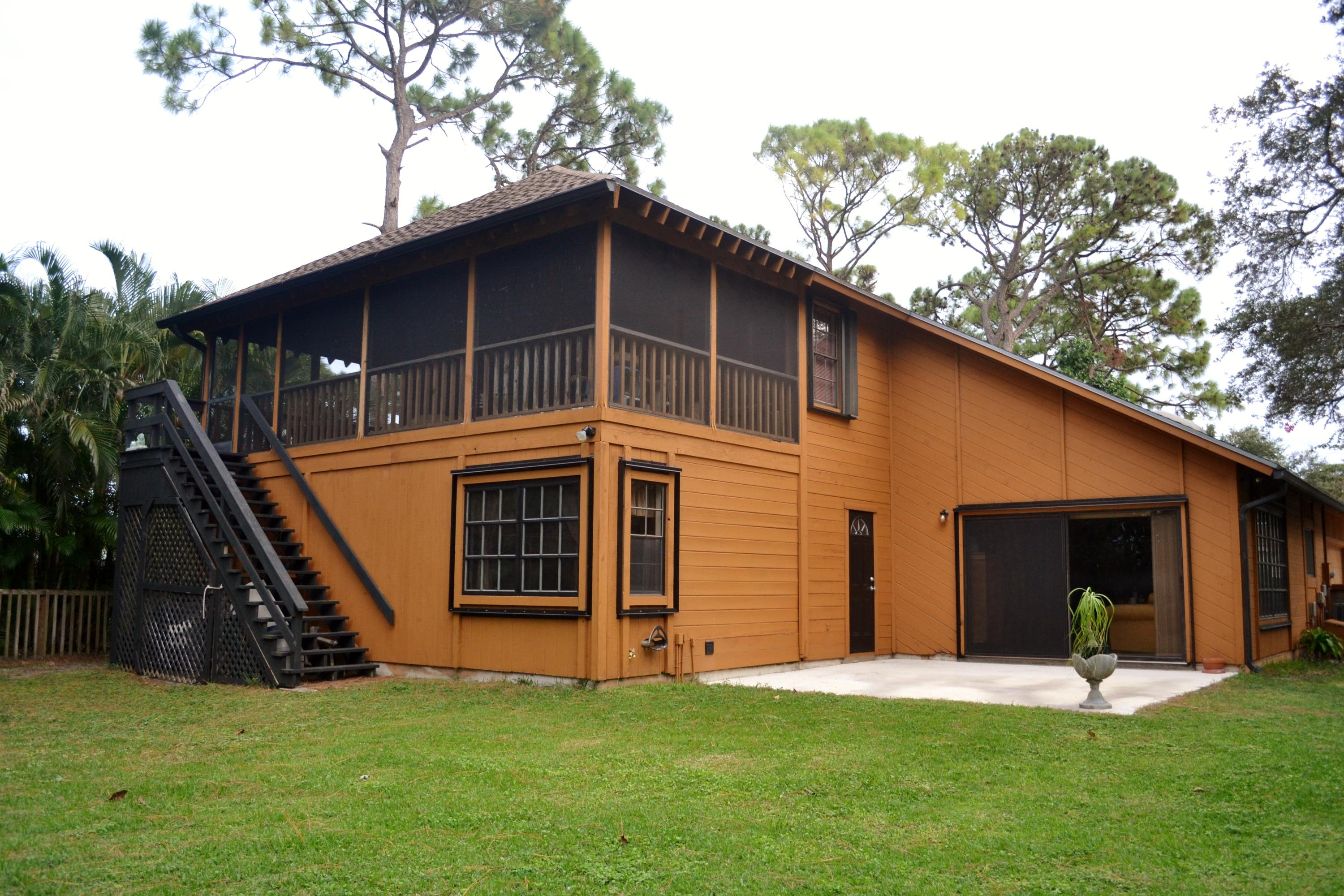6063 Wood Lake Road Jupiter, FL 33458 - Photo 55 of 60 ROOFED SCREENED PORCH AND BACK DECK