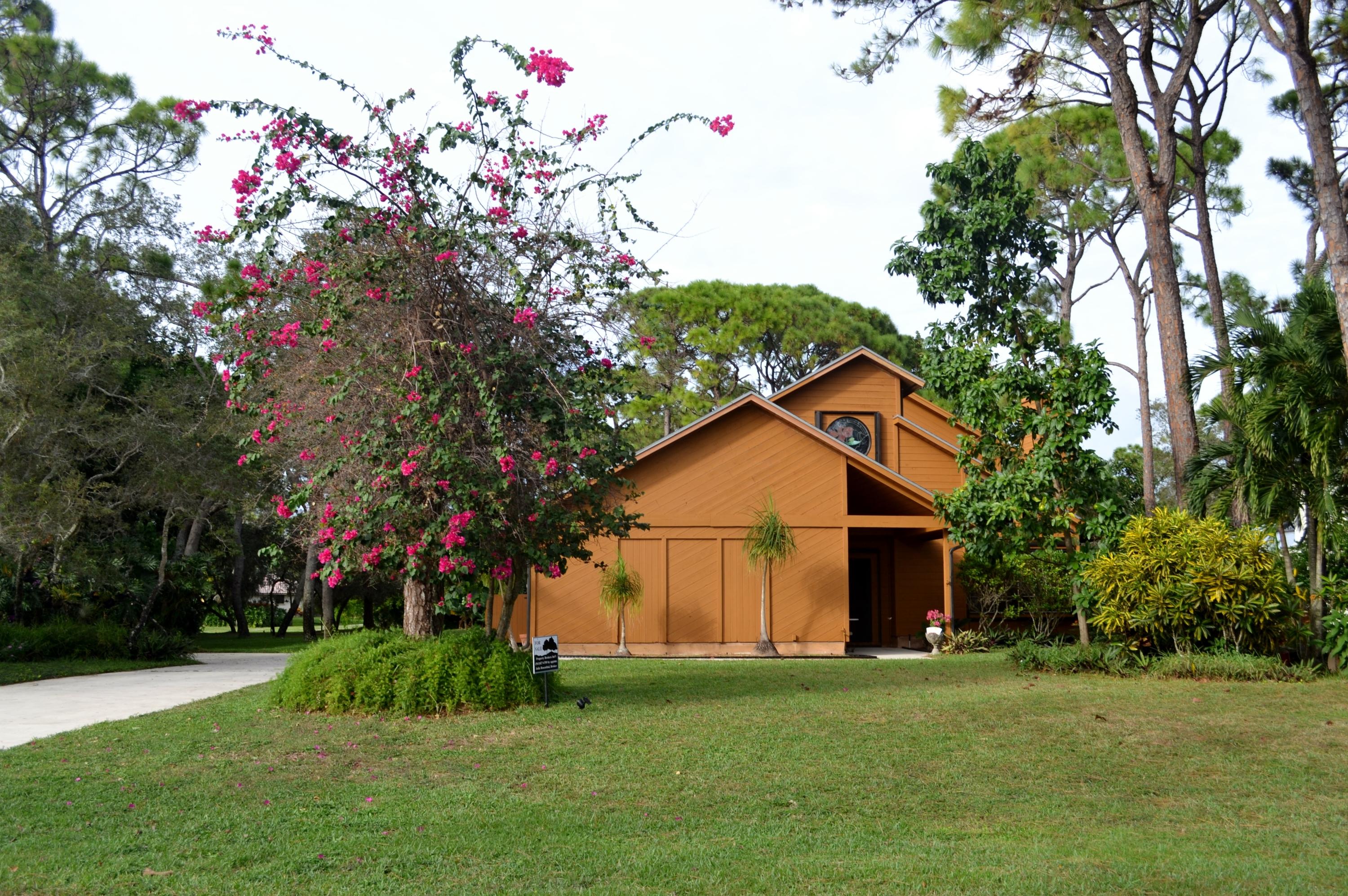 6063 Wood Lake Road Jupiter, FL 33458 - Photo 57 of 60 FRONT YARD PRIVACY PLANTINGS