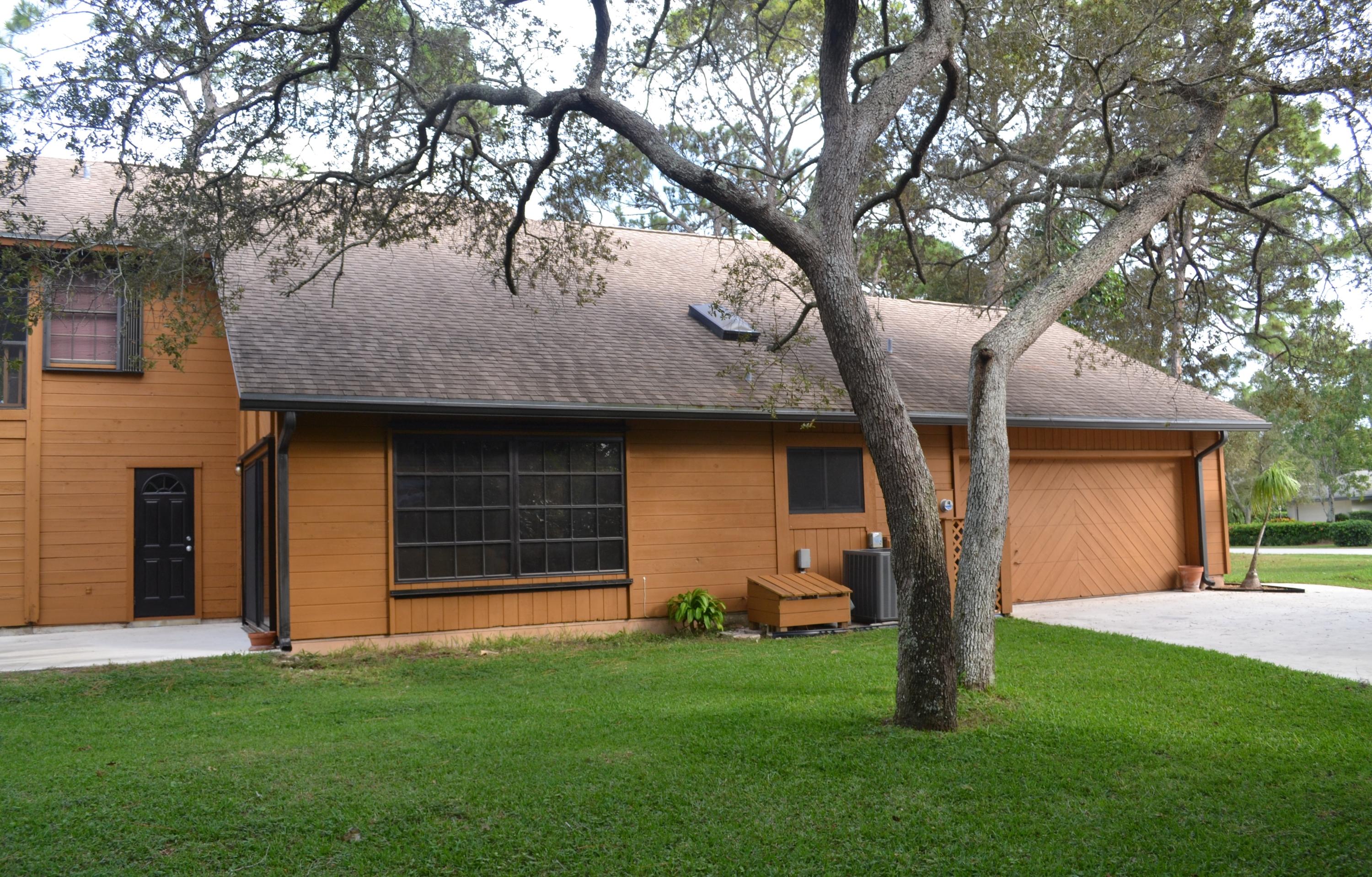 6063 Wood Lake Road Jupiter, FL 33458 - Photo 58 of 60 EXTERIOR SIDE VIEW OF GARAGE
