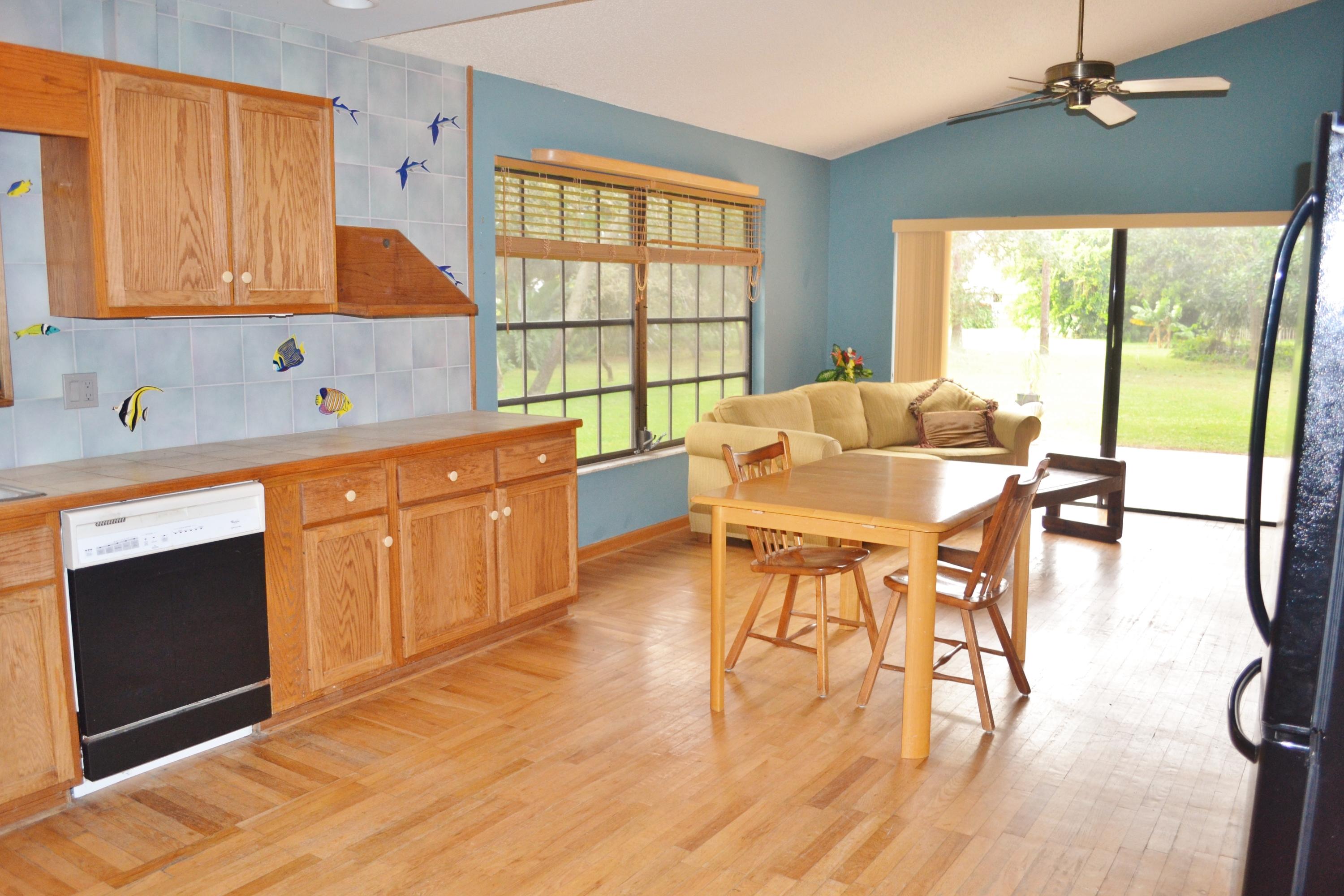 6063 Wood Lake Road Jupiter, FL 33458 - Photo 6 of 60 KITCHEN OPENS TO THE FAMILY AREA