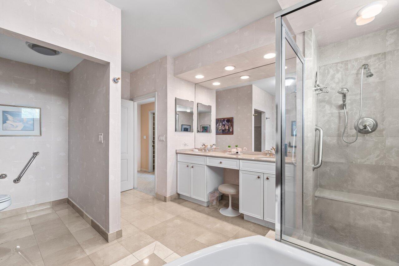 500 Southeast Mizner Boulevard, Unit A411 Boca Raton, FL 33432 - Photo 30 of 67 a bathroom with a sink and shower