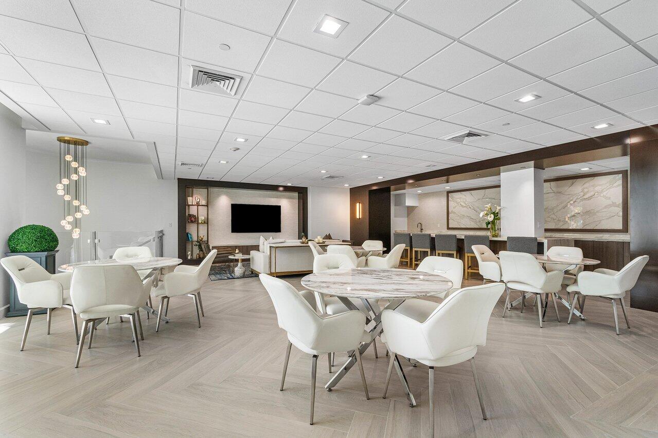500 Southeast Mizner Boulevard, Unit A411 Boca Raton, FL 33432 - Photo 46 of 67 a view of a dining room with furniture window and wooden floor