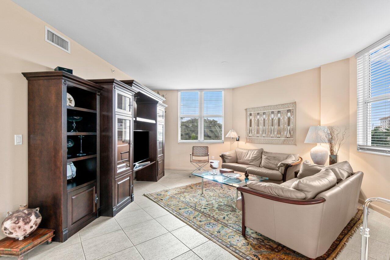 500 Southeast Mizner Boulevard, Unit A411 Boca Raton, FL 33432 - Photo 9 of 67 a living room with furniture and a flat screen tv