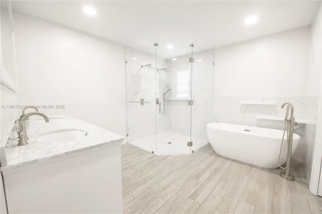 a bathroom with a bathtub and a sink