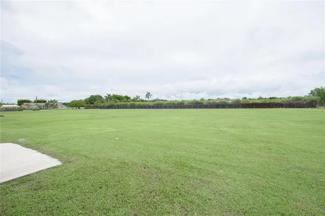 a view of a lake with a big yard