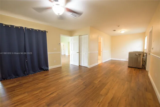 a view of a livingroom with wooden floor