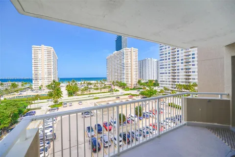 a view of balcony with furniture