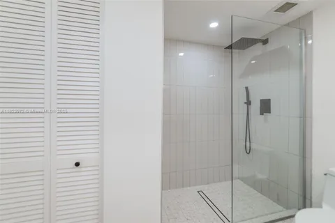 a bedroom with bed and window