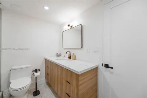 a room with painting and a lamp