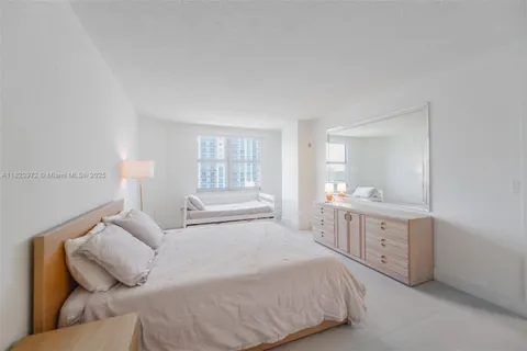 a view of a patio with a table and chairs