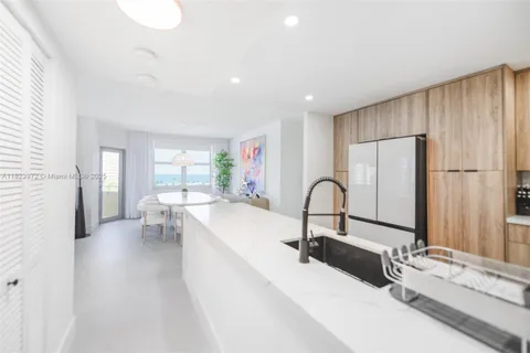 a kitchen with a sink and a large window