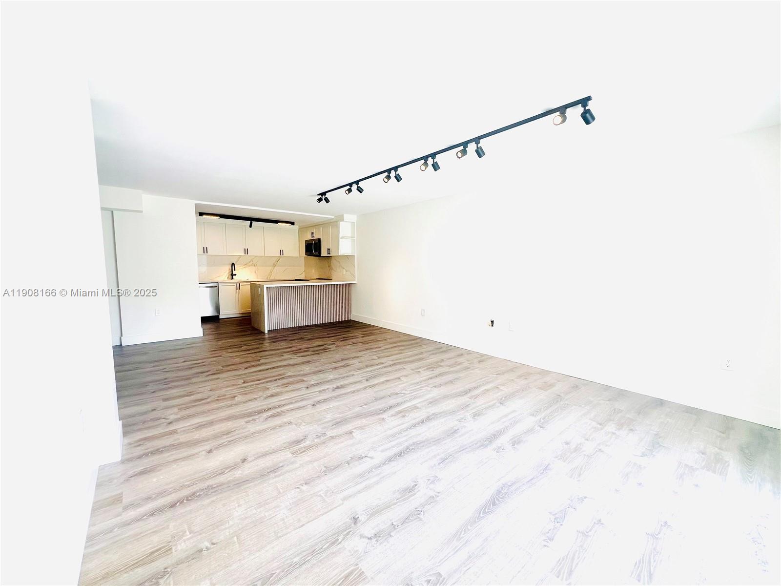 201 Jefferson Avenue, Unit 4C Miami Beach, FL 33139 - Photo 8 of 13 a view of kitchen and utility room