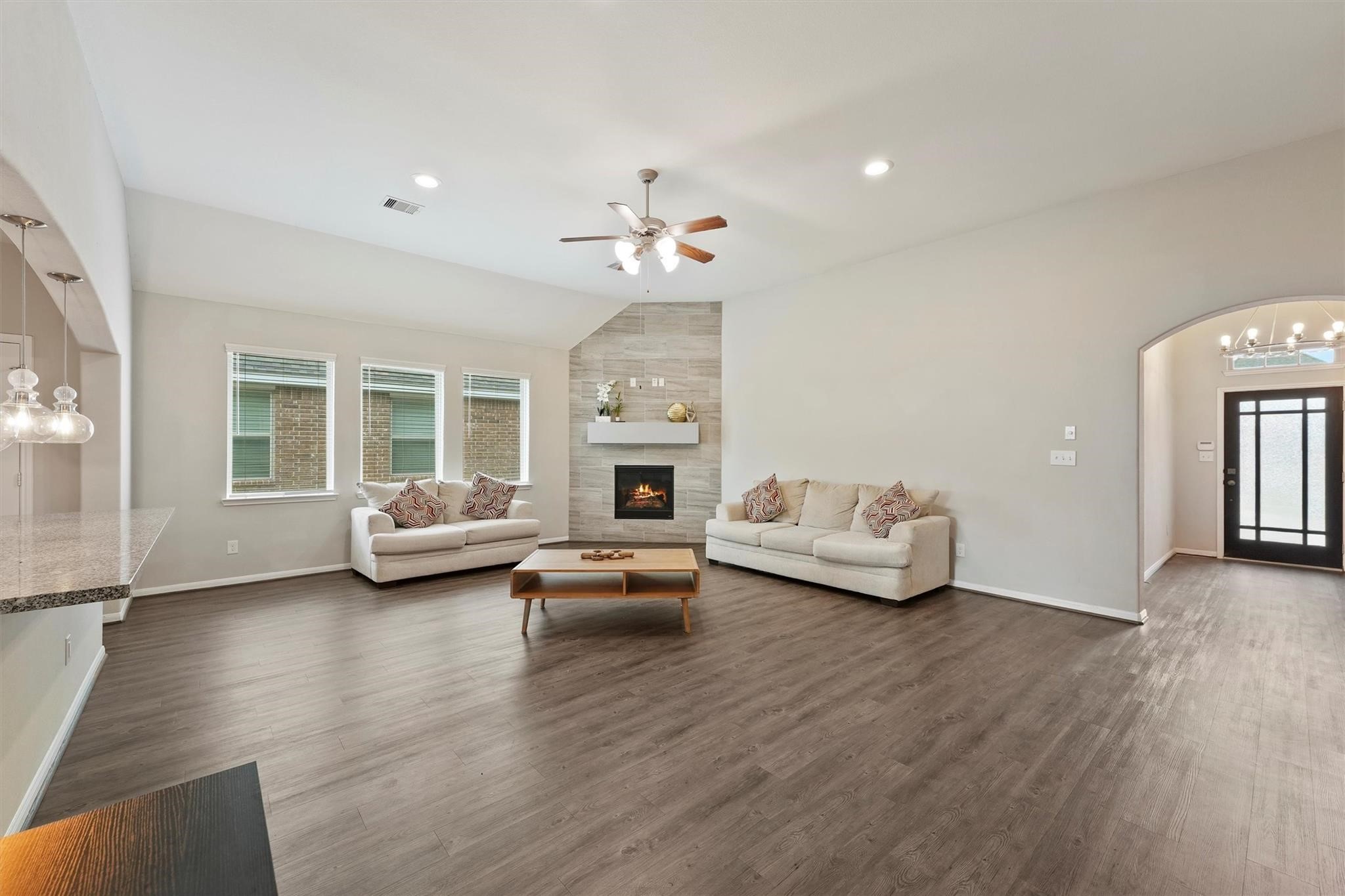 15103 Dry Ridge Court Humble, TX 77346 - Photo 1 of 28 a living room with furniture and a fireplace