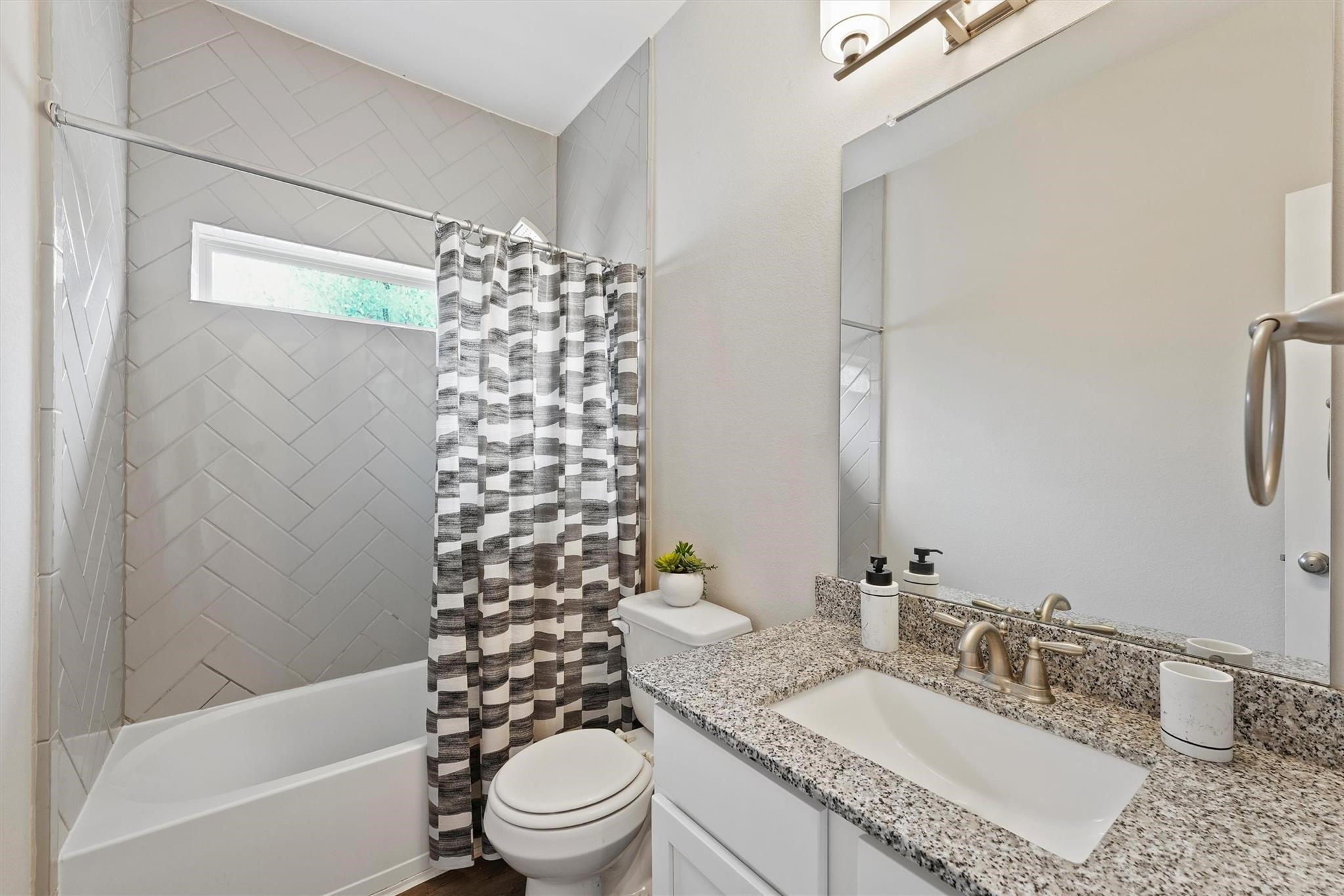 15103 Dry Ridge Court Humble, TX 77346 - Photo 13 of 28 a bathroom with a granite countertop sink toilet and shower
