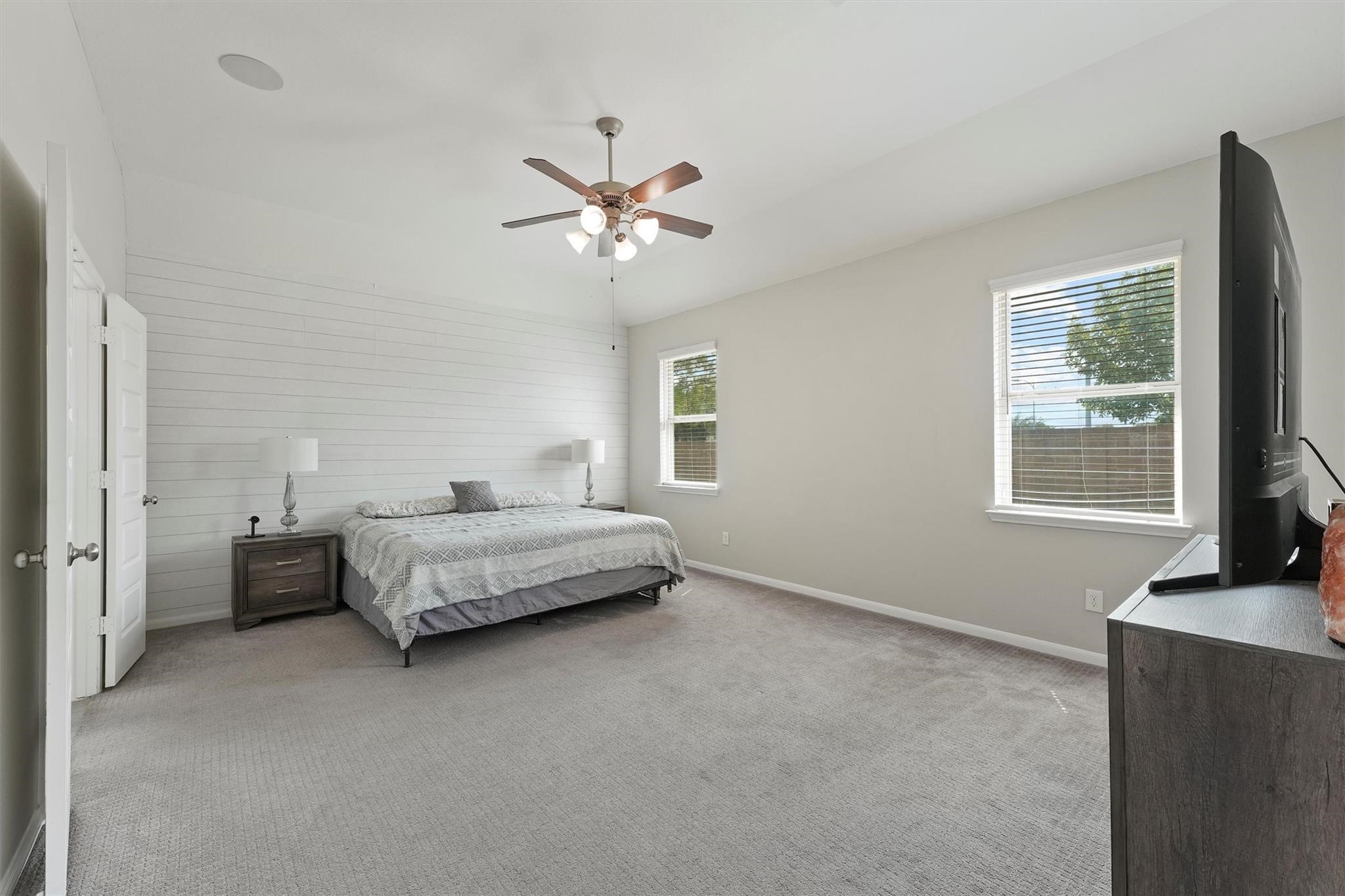 15103 Dry Ridge Court Humble, TX 77346 - Photo 16 of 28 a spacious bedroom with a bed and a window