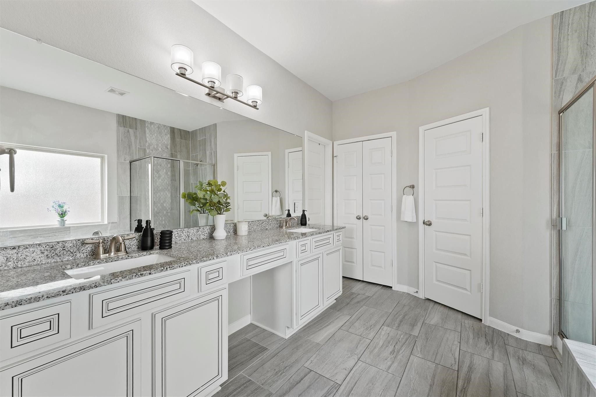15103 Dry Ridge Court Humble, TX 77346 - Photo 17 of 28 a large white kitchen with a sink and dishwasher
