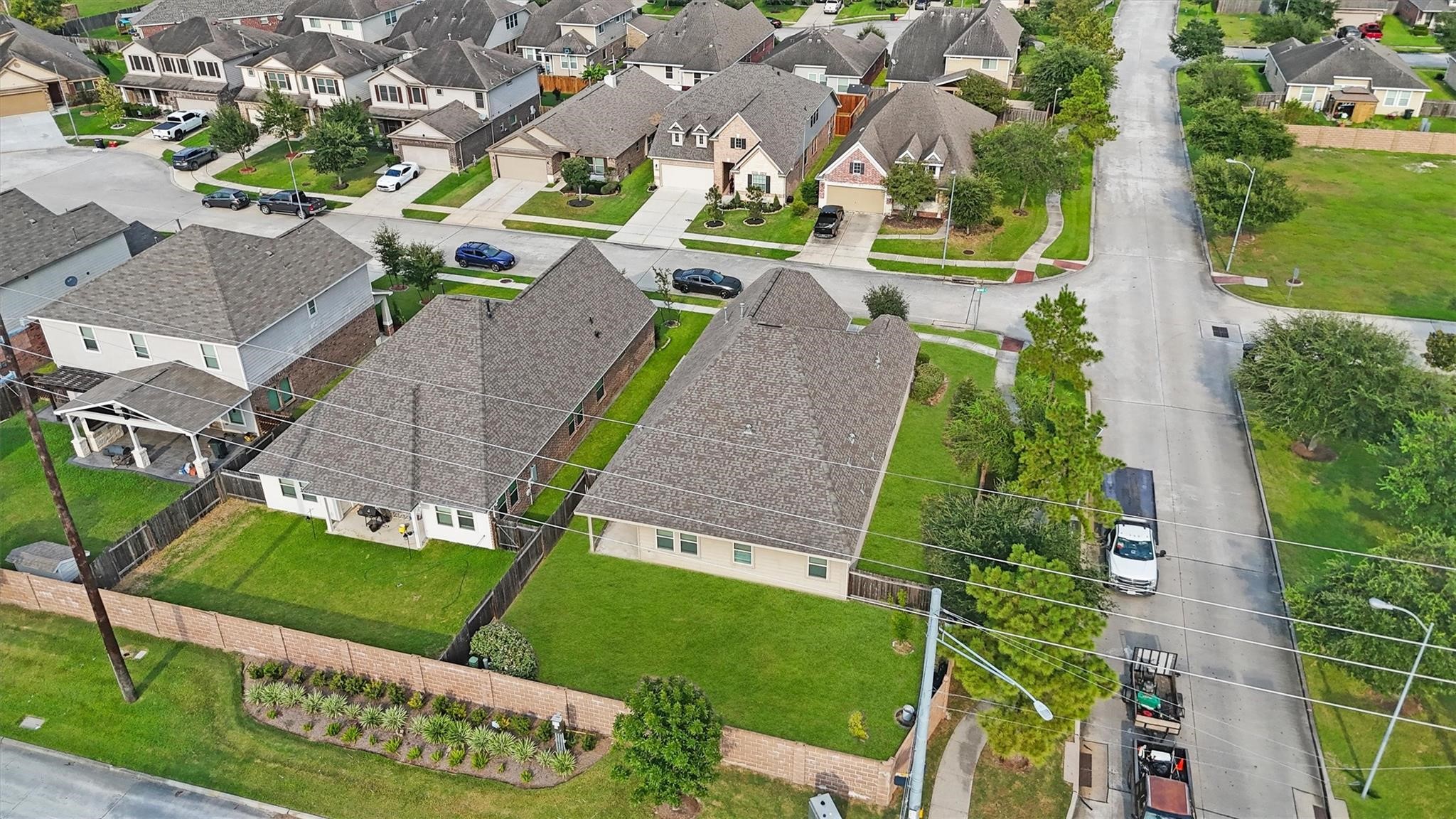 15103 Dry Ridge Court Humble, TX 77346 - Photo 24 of 28 an aerial view of a house with a garden and trees