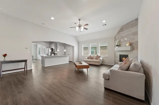 a living room with furniture and a fireplace