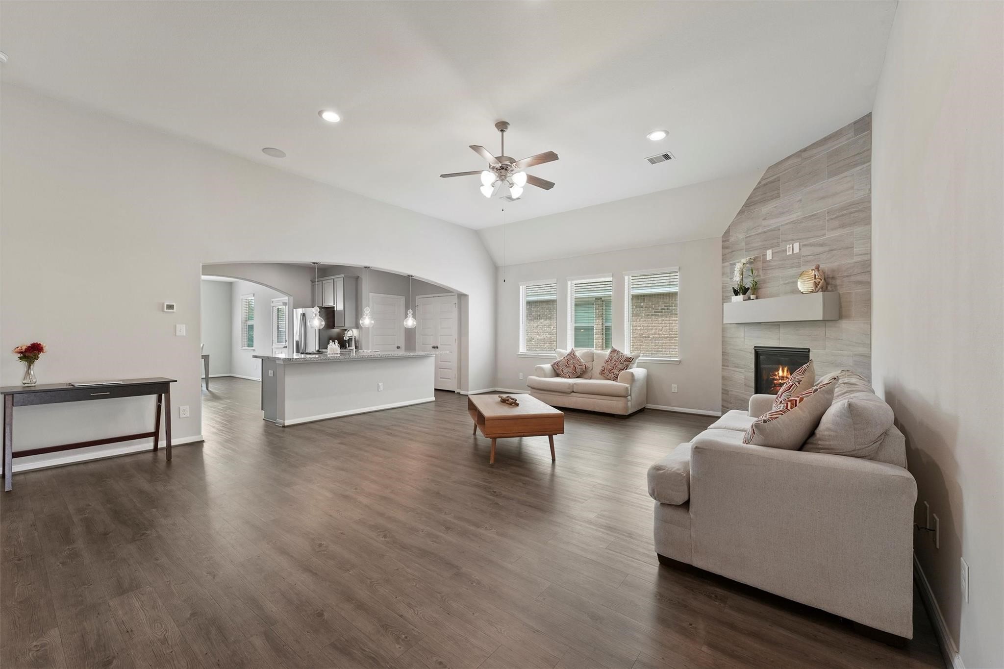 15103 Dry Ridge Court Humble, TX 77346 - Photo 4 of 28 a living room with furniture and a fireplace