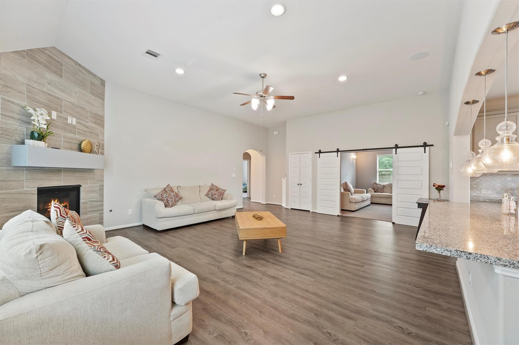 15103 Dry Ridge Court Humble, TX 77346 - Photo 5 of 28 a living room with furniture and a fireplace