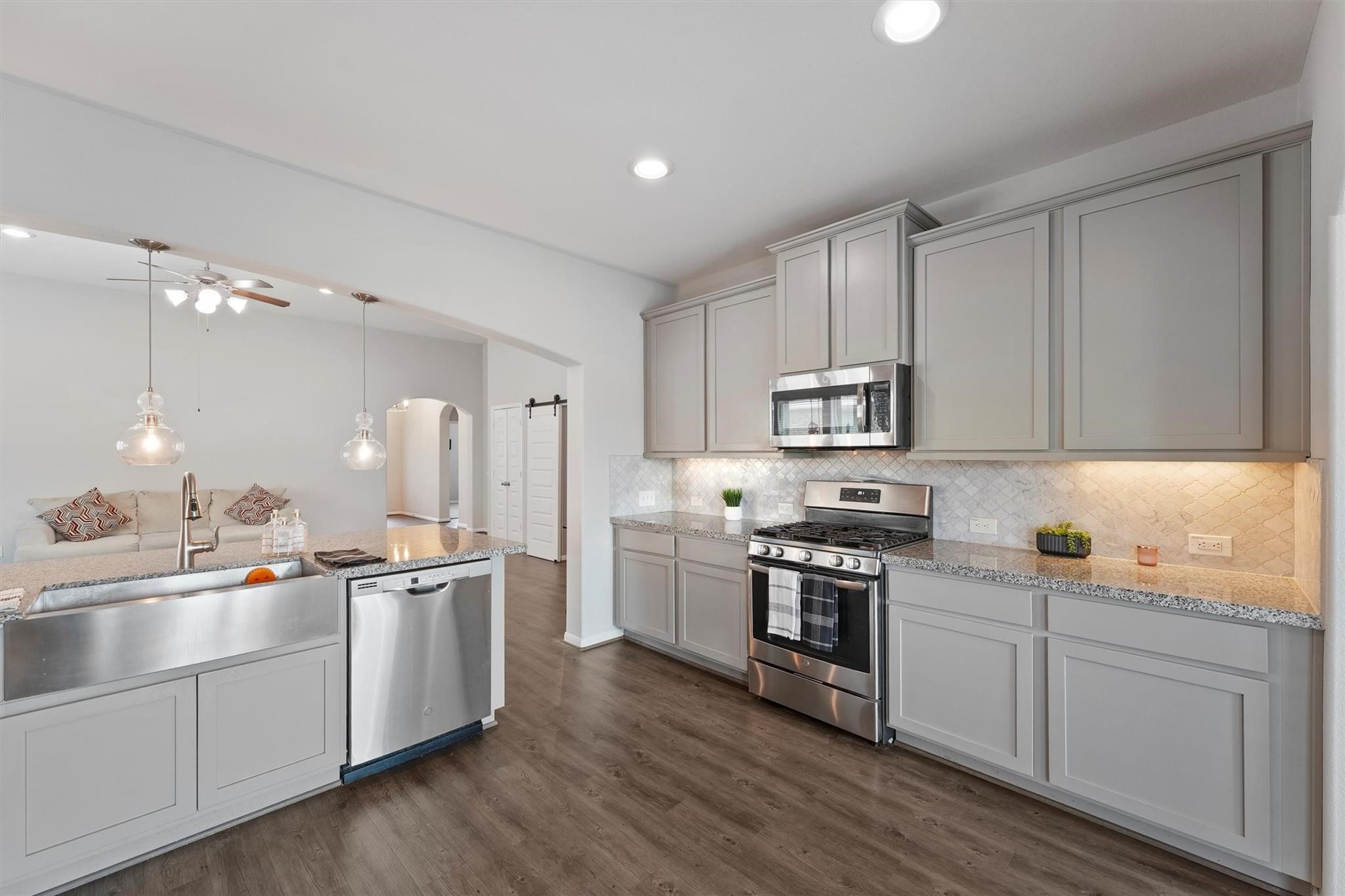 15103 Dry Ridge Court Humble, TX 77346 - Photo 8 of 28 a kitchen with appliances cabinets and a sink