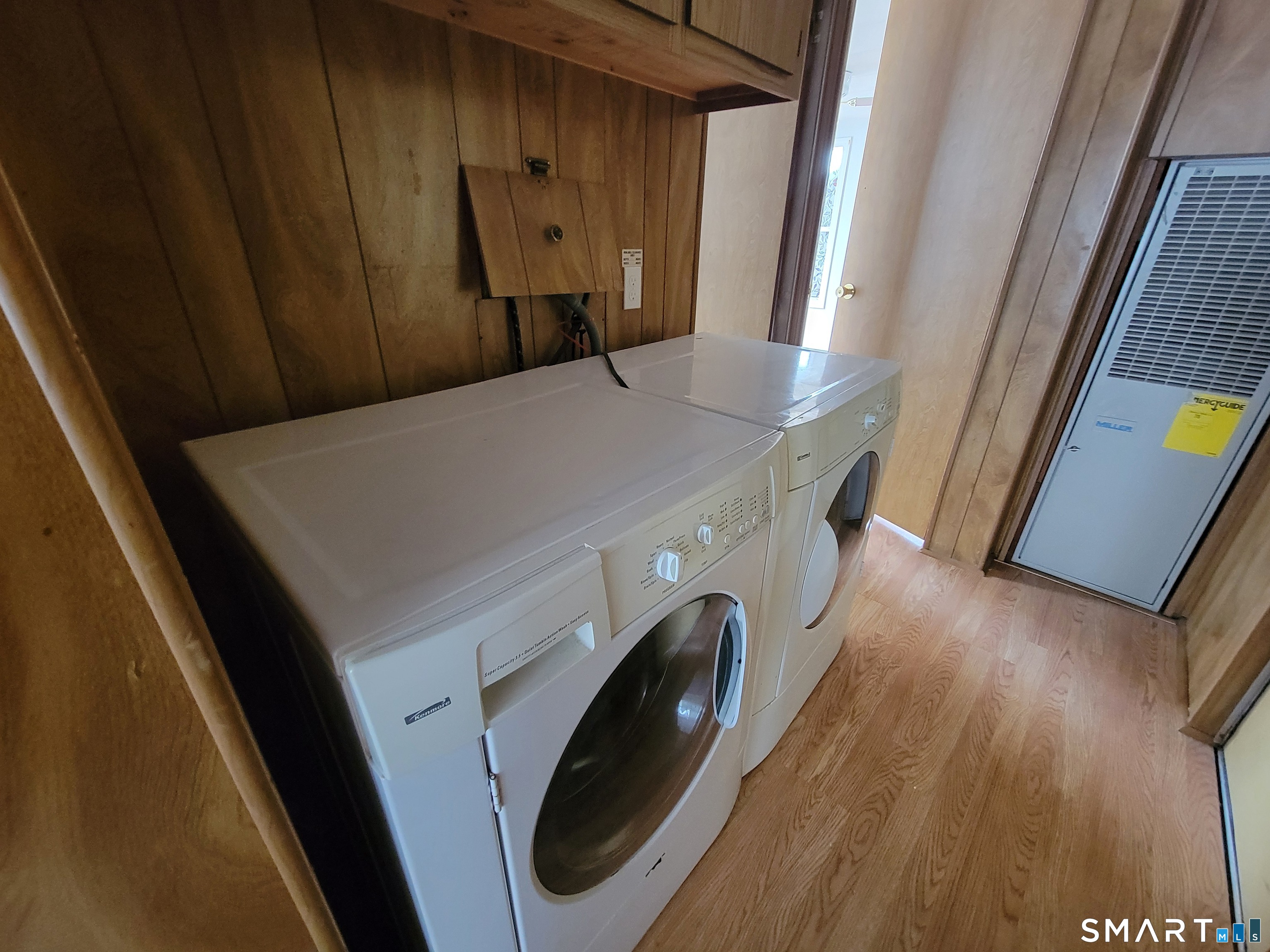 1290 N Road Groton, CT 06340 - Photo 9 of 11 a view of a hallway with washer and dryer