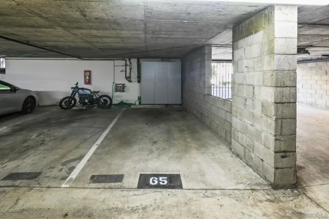 a view of a patio with a table and chairs and potted plants