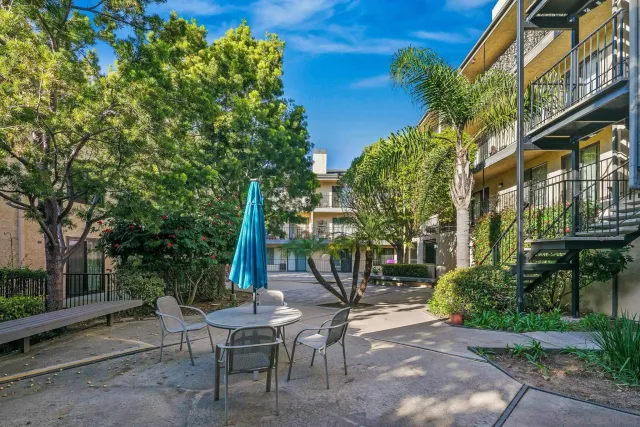 a front view of a building with street view