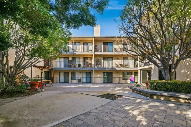 a view of a street with a yard