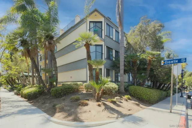 a view of a building with a yard and garden