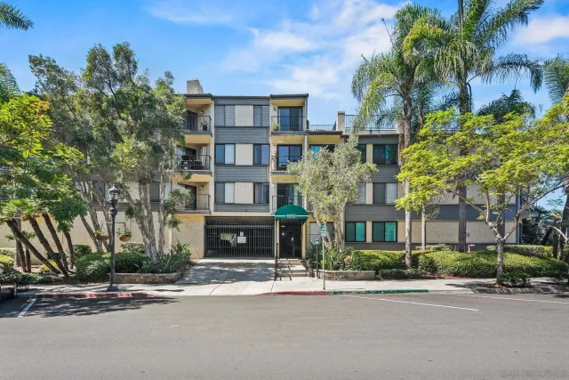 a car parked in front of a brick building